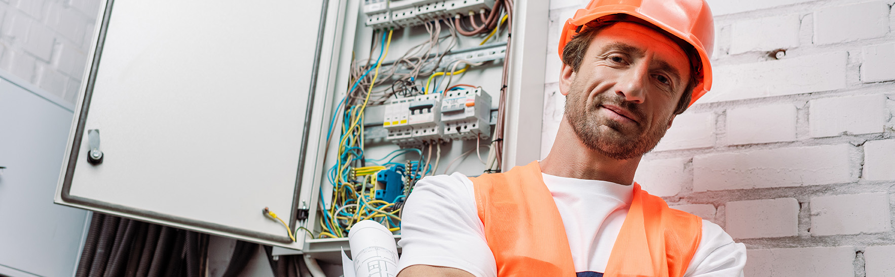 Electrician working on an electrical panel